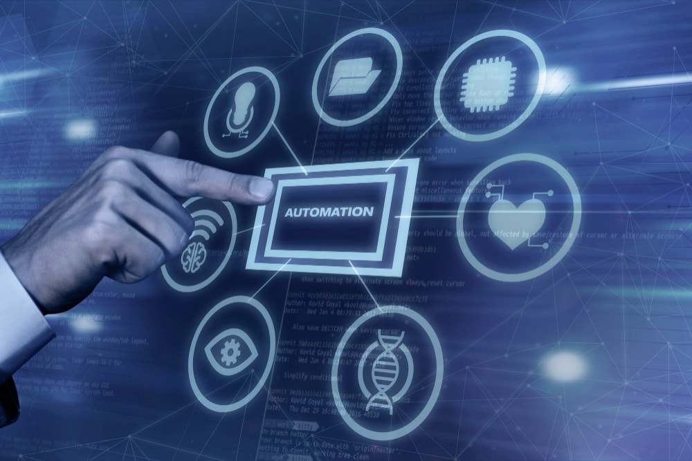 AI-Powered Automation in Digital Asset Management A finger points to a button labeled "automation" surrounded by icons, illustrating how to choose a DAM system with AI-automated features.