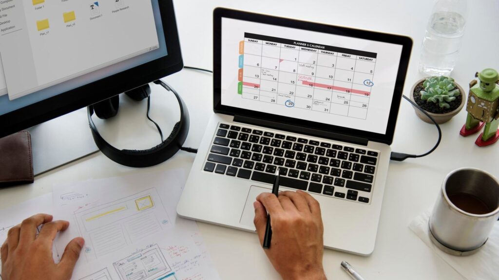 A professional using a digital marketing calendar with scheduled content, AI suggestions, and performance metrics like engagement and SEO.